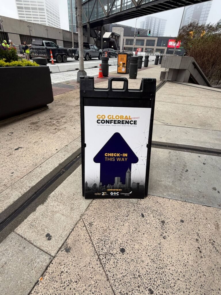 Check-in sign in a black Signicade A-frame outside a venue